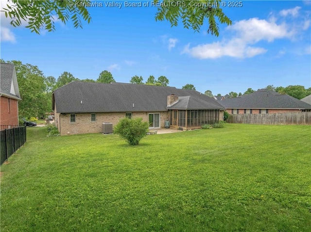 3710 Cambridge Cir, Hurricane, WV 25526 - rear view of house with a patio, a fenced backyard, and brick siding