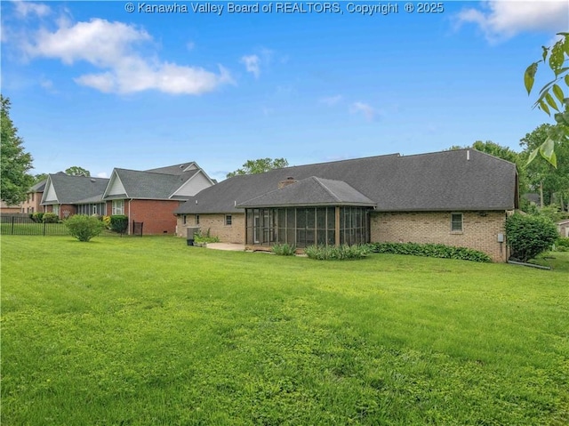 3710 Cambridge Cir, Hurricane, WV 25526 - rear view of property featuring a sunroom, brick siding, a patio, and roof with shingles