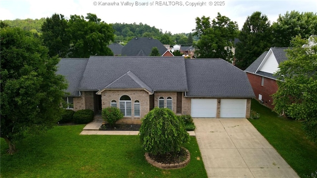 3710 Cambridge Cir, Hurricane, WV 25526 - view of front of house featuring an attached garage, driveway, brick siding, and a front yard