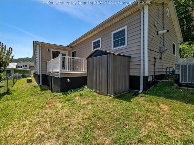 9012 Florida Ave, Marmet, WV 25315 - rear view of property with a storage unit and a wooden deck