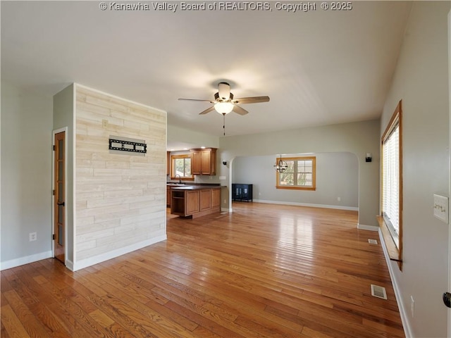 9012 Florida Ave, Marmet, WV 25315 - unfurnished living room with ceiling fan, light wood finished floors, and plenty of natural light