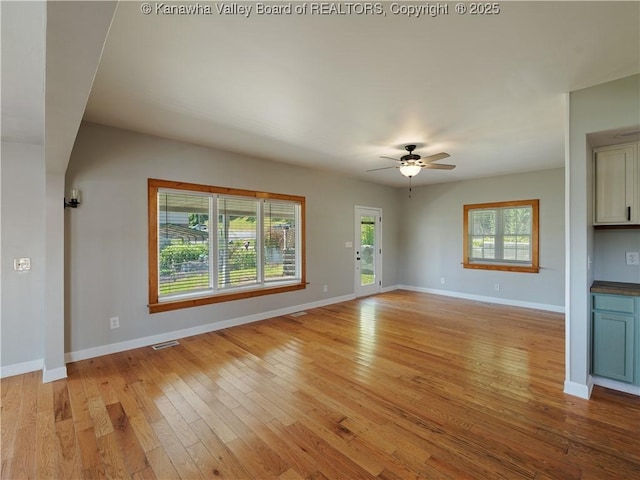 9012 Florida Ave, Marmet, WV 25315 - unfurnished living room with light wood-type flooring and ceiling fan