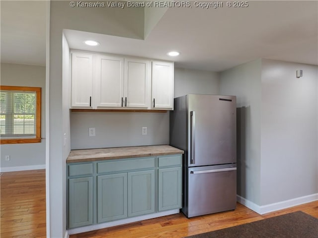 9012 Florida Ave, Marmet, WV 25315 - kitchen featuring freestanding refrigerator, light wood-style floors, white cabinets, butcher block countertops, and recessed lighting