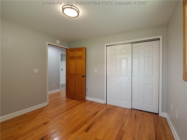 9012 Florida Ave, Marmet, WV 25315 - unfurnished bedroom with light wood finished floors and a closet