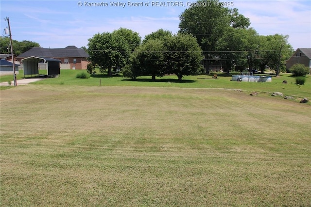 401 Green Acres Dr, Hurricane, WV 25526 - view of grassy yard with a detached carport