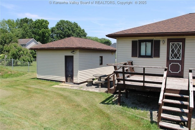 401 Green Acres Dr, Hurricane, WV 25526 - back of property featuring a deck, roof with shingles, and an outdoor structure