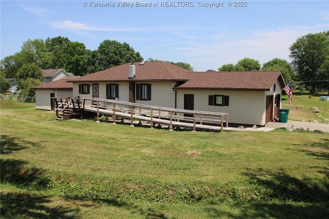 401 Green Acres Dr, Hurricane, WV 25526 - back of house featuring a lawn, a wooden deck, and a shingled roof