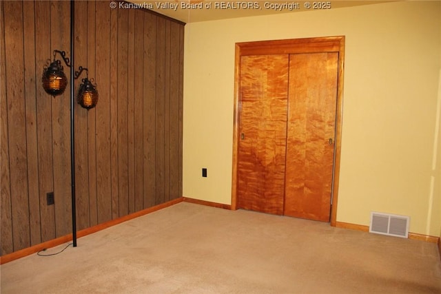 401 Green Acres Dr, Hurricane, WV 25526 - unfurnished bedroom with carpet and wooden walls