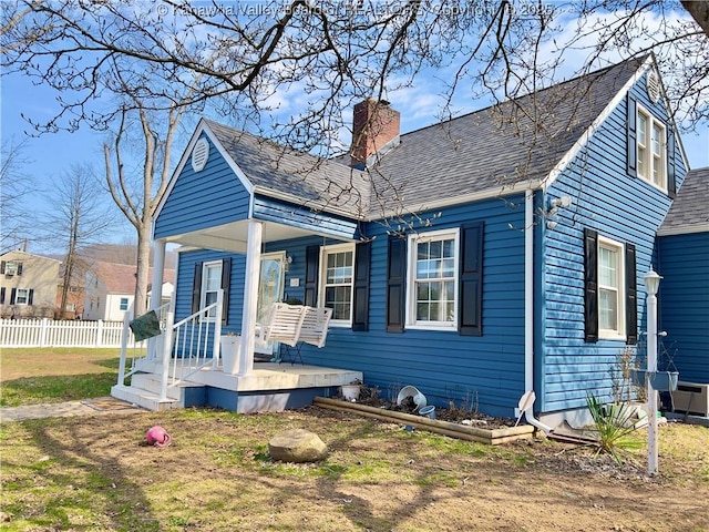 602 43rd St SE, Charleston, WV 25304 - view of front of house featuring a porch, a chimney, and roof with shingles