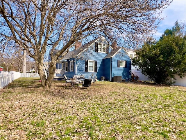 602 43rd St SE, Charleston, WV 25304 - back of house with a fenced backyard and a chimney