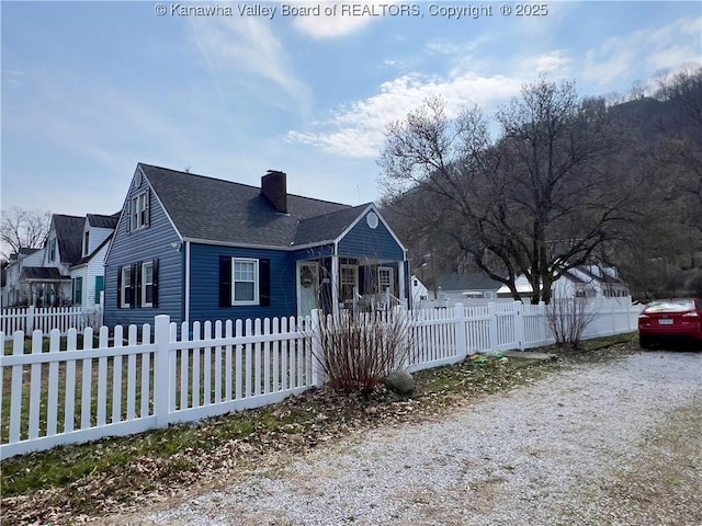 602 43rd St SE, Charleston, WV 25304 - view of front of house with a chimney, a shingled roof, and a fenced front yard