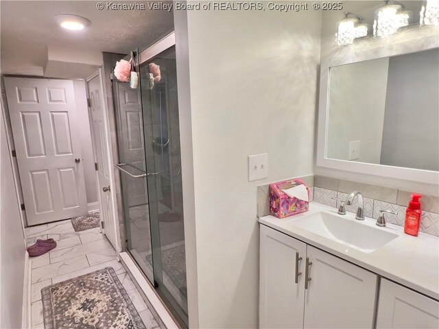 602 43rd St SE, Charleston, WV 25304 - full bath featuring vanity, marble look tiles, a shower stall, and a chandelier