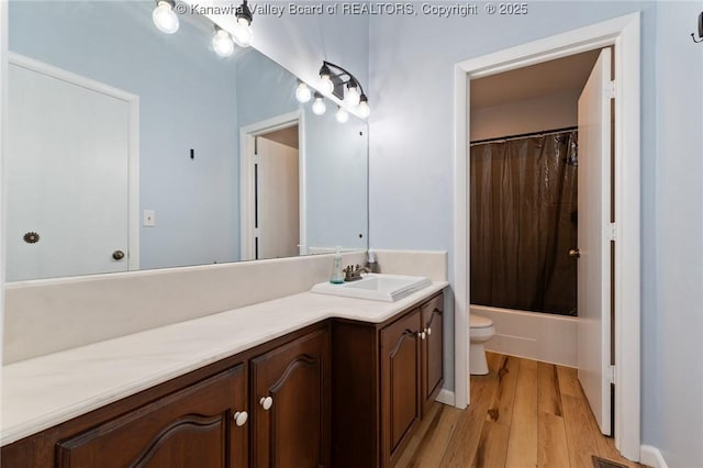 815 Chappell Rd, Charleston, WV 25304 - full bath with vanity, wood finished floors, and shower / bath combo with shower curtain