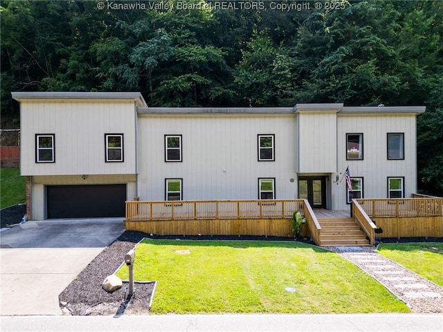 815 Chappell Rd, Charleston, WV 25304 - view of front of house with french doors, an attached garage, a front yard, and concrete driveway