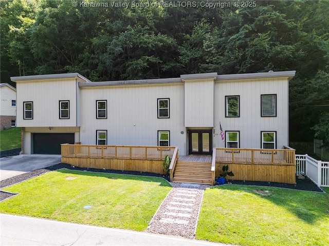 815 Chappell Rd, Charleston, WV 25304 - view of front facade with a garage, concrete driveway, french doors, and a wooden deck