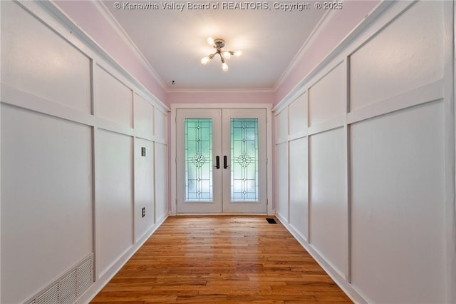 815 Chappell Rd, Charleston, WV 25304 - entryway featuring ornamental molding, light wood-style flooring, and french doors