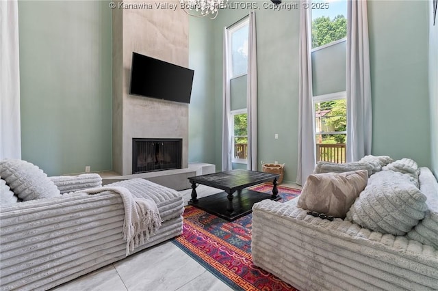 815 Chappell Rd, Charleston, WV 25304 - living room with a fireplace, a chandelier, and a towering ceiling