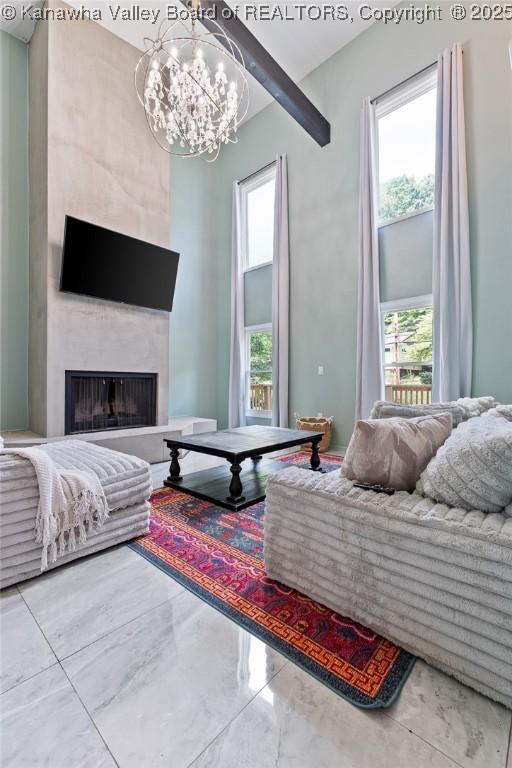 815 Chappell Rd, Charleston, WV 25304 - living area featuring a fireplace, a chandelier, healthy amount of natural light, and marble finish flooring
