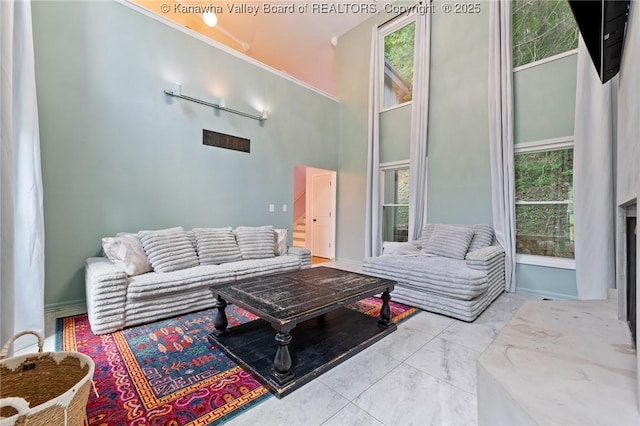 815 Chappell Rd, Charleston, WV 25304 - living room with marble look tiles, plenty of natural light, and a high ceiling