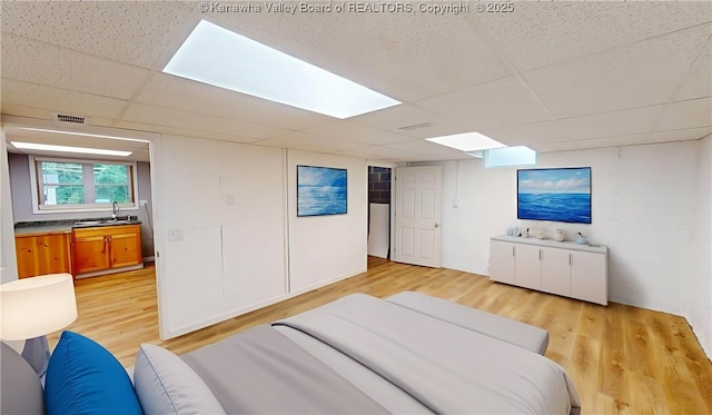 5490 Fisher Bowen Branch Rd, Wayne, WV 25570 - bedroom featuring a drop ceiling and light wood-type flooring
