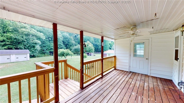 5490 Fisher Bowen Branch Rd, Wayne, WV 25570 - deck featuring ceiling fan, a lawn, and an outbuilding