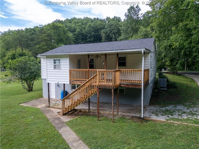 5490 Fisher Bowen Branch Rd, Wayne, WV 25570 - view of front of home with a front yard, stairway, a forest view, a porch, and roof with shingles