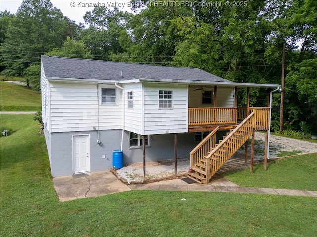 5490 Fisher Bowen Branch Rd, Wayne, WV 25570 - back of property with stairway, a lawn, ceiling fan, and a shingled roof