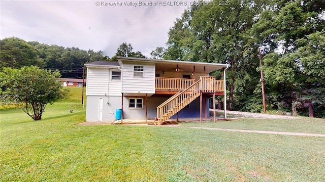 5490 Fisher Bowen Branch Rd, Wayne, WV 25570 - rear view of house featuring stairs, a lawn, and a wooden deck