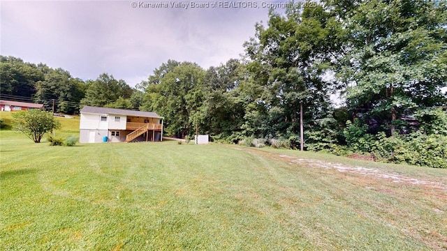 5490 Fisher Bowen Branch Rd, Wayne, WV 25570 - view of grassy yard featuring stairs and a wooden deck