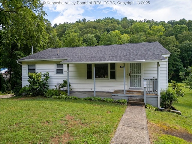 5490 Fisher Bowen Branch Rd, Wayne, WV 25570 - view of front of house featuring a front lawn, covered porch, a wooded view, and a shingled roof