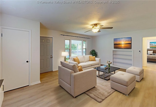 5490 Fisher Bowen Branch Rd, Wayne, WV 25570 - living area with light wood-type flooring, a ceiling fan, and built in features
