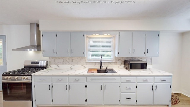 5490 Fisher Bowen Branch Rd, Wayne, WV 25570 - kitchen with wall chimney range hood, appliances with stainless steel finishes, backsplash, light stone countertops, and white cabinets