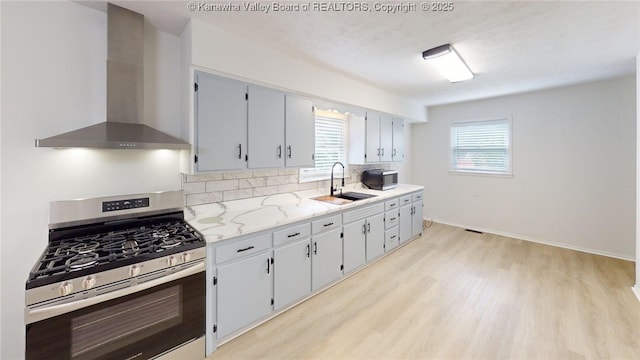 5490 Fisher Bowen Branch Rd, Wayne, WV 25570 - kitchen with stainless steel appliances, wall chimney exhaust hood, light wood-style floors, and plenty of natural light