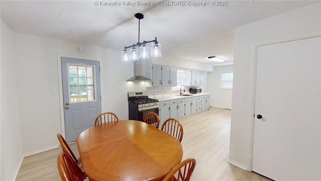 5490 Fisher Bowen Branch Rd, Wayne, WV 25570 - dining space with light wood-style floors and baseboards