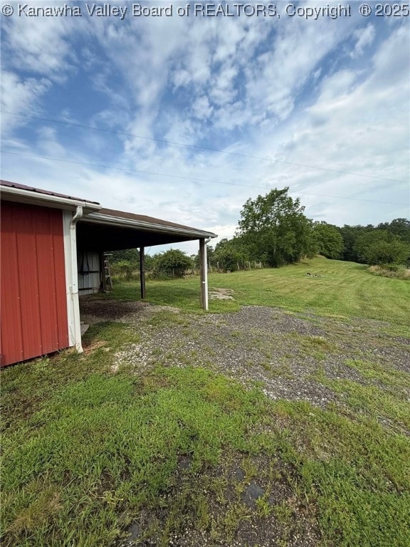 4303 Thomas Ridge Rd, Leon, WV 25123 - view of green lawn with a pole building and an outdoor structure