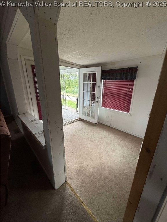 4303 Thomas Ridge Rd, Leon, WV 25123 - corridor featuring a textured ceiling and carpet flooring