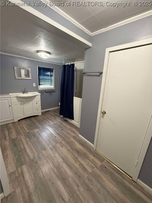 4303 Thomas Ridge Rd, Leon, WV 25123 - full bath featuring crown molding, vanity, a shower with curtain, and wood finished floors
