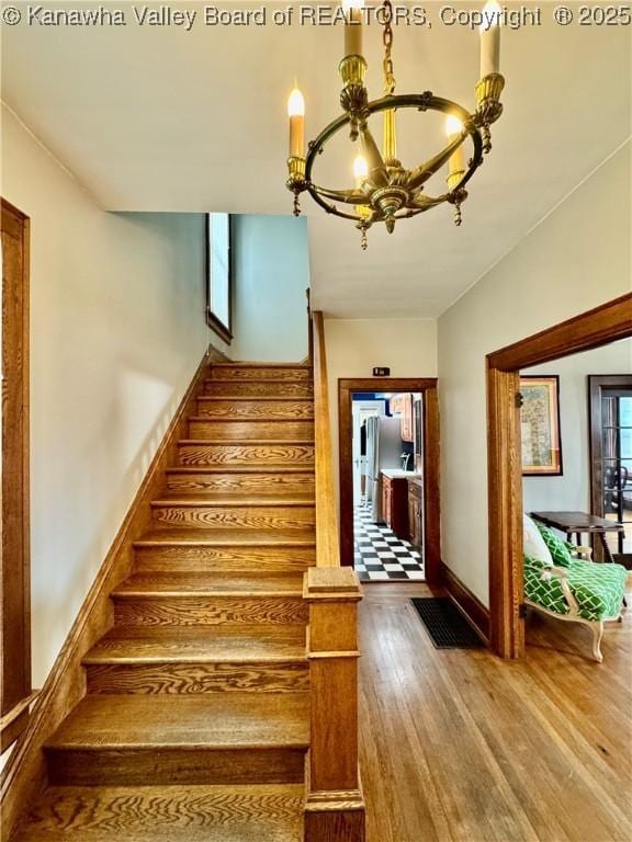 406 Elm St, Charleston, WV 25302 - stairs with a chandelier and wood finished floors