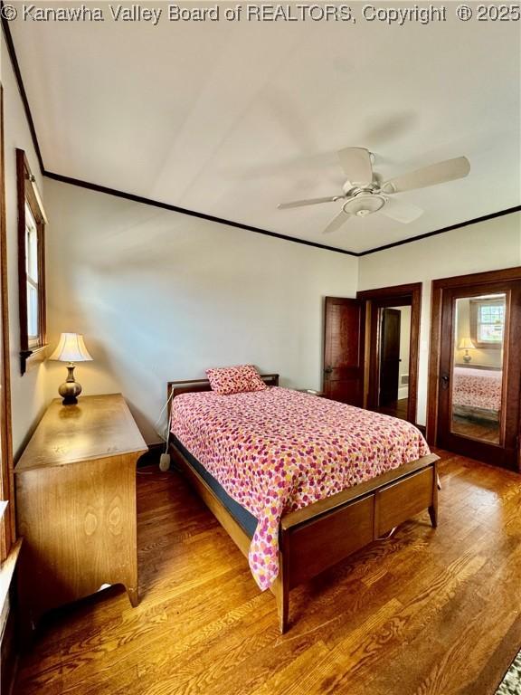 406 Elm St, Charleston, WV 25302 - bedroom featuring wood finished floors, crown molding, and a ceiling fan