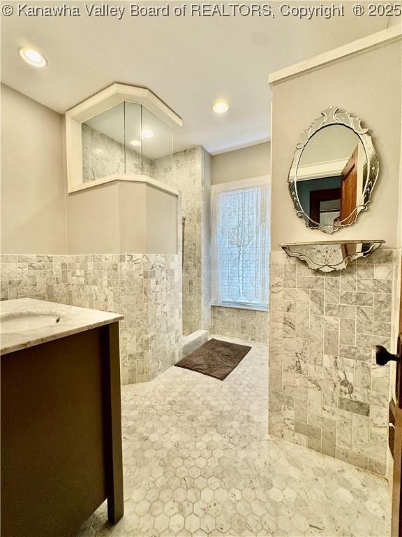 406 Elm St, Charleston, WV 25302 - full bath featuring tile walls, vanity, recessed lighting, and wainscoting