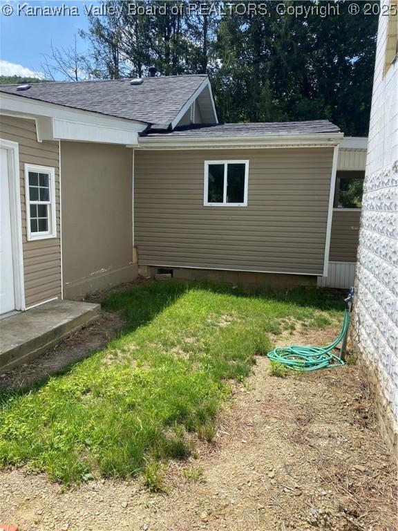 42 Pine Cone Rd, Elkview, WV 25071 - view of home's exterior featuring roof with shingles