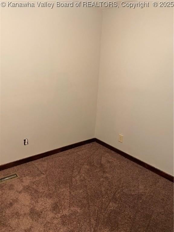 42 Pine Cone Rd, Elkview, WV 25071 - spare room featuring dark carpet and baseboards