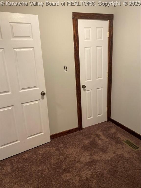 42 Pine Cone Rd, Elkview, WV 25071 - empty room with dark colored carpet and baseboards