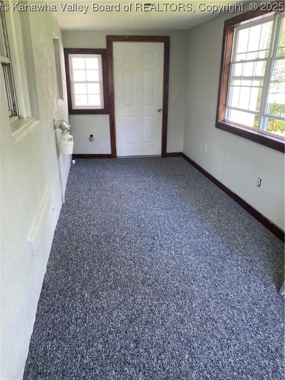 42 Pine Cone Rd, Elkview, WV 25071 - unfurnished bedroom featuring baseboards and speckled floor
