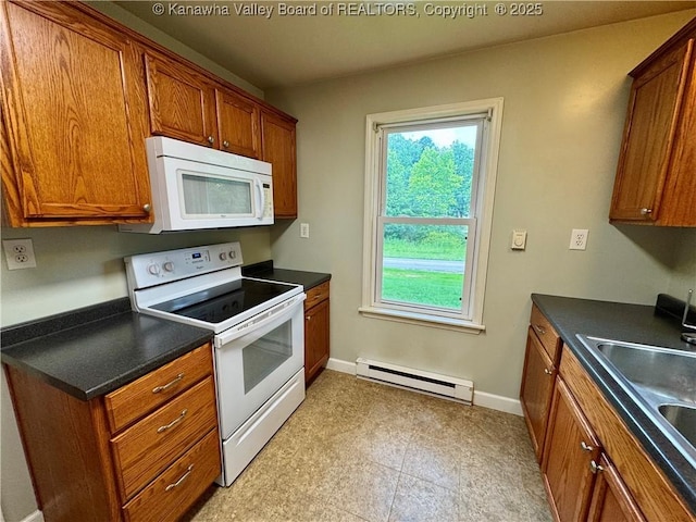 913 Charleston Rd, Point Pleasant, WV 25550 - kitchen featuring white appliances, a baseboard heating unit, brown cabinets, and dark countertops