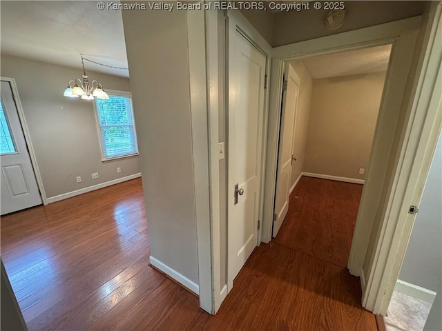 913 Charleston Rd, Point Pleasant, WV 25550 - hall featuring wood finished floors and a chandelier