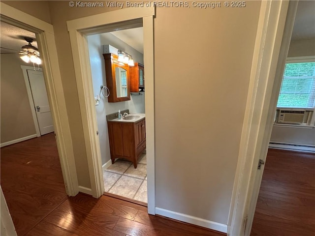 913 Charleston Rd, Point Pleasant, WV 25550 - hallway featuring cooling unit, light wood-type flooring, and baseboard heating