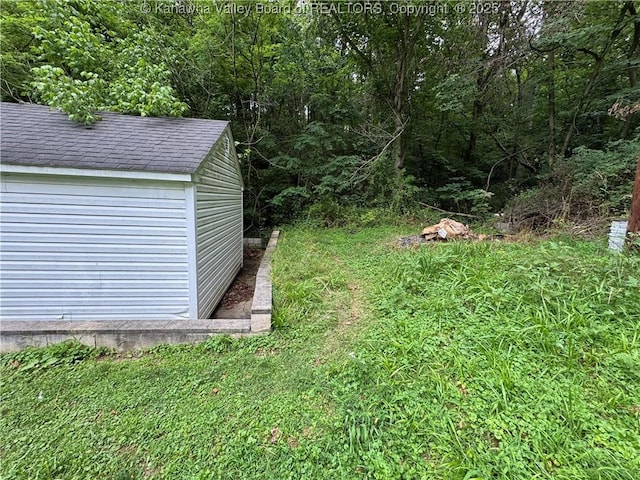 913 Charleston Rd, Point Pleasant, WV 25550 - view of yard featuring a shed and a view of trees