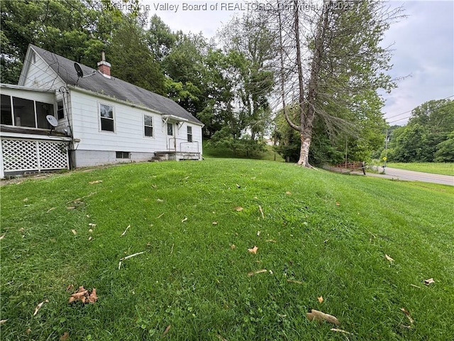 913 Charleston Rd, Point Pleasant, WV 25550 - view of grassy yard featuring a sunroom and view of wooded area