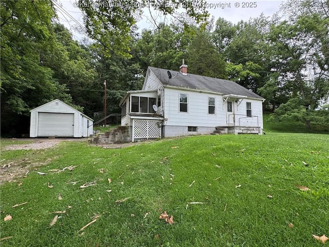 913 Charleston Rd, Point Pleasant, WV 25550 - back of house with a sunroom, a lawn, a storage unit, and a chimney